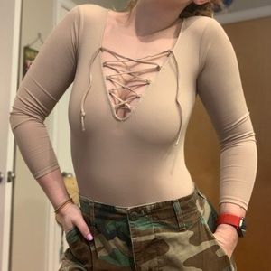 Nude lace-up body suit